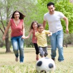 family playing soccer