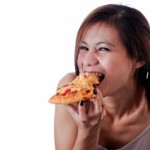girl eating pizza