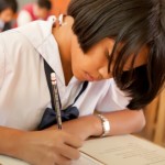 schoolgirl taking exam